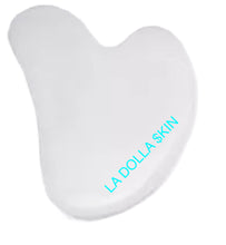 Load image into Gallery viewer, The LA DOLLA $KIN WHITE &quot;FACIAL GUA SHA&quot; Facial Tool is best used with the DERMAFACE MD HERO PRODUCT DERMAFACE MD 1000X Hyaluroinic Serum. The Hyaluronic is pefect to help glide the GUA SHA, and the GUA SHA helps the HYALURONIC Molecules penetrate the skin, and pass through the skin barrier to attract 1000x their weight in water.
