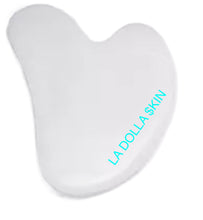 Load image into Gallery viewer, The LA DOLLA $KIN WHITE &quot;FACIAL GUA SHA&quot; Facial Tool is best used with the DERMAFACE MD HERO PRODUCT DERMAFACE MD 1000X Hyaluroinic Serum. The Hyaluronic is pefect to help glide the GUA SHA, and the GUA SHA helps the HYALURONIC Molecules penetrate the skin, and pass through the skin barrier to attract 1000x their weight in water.
